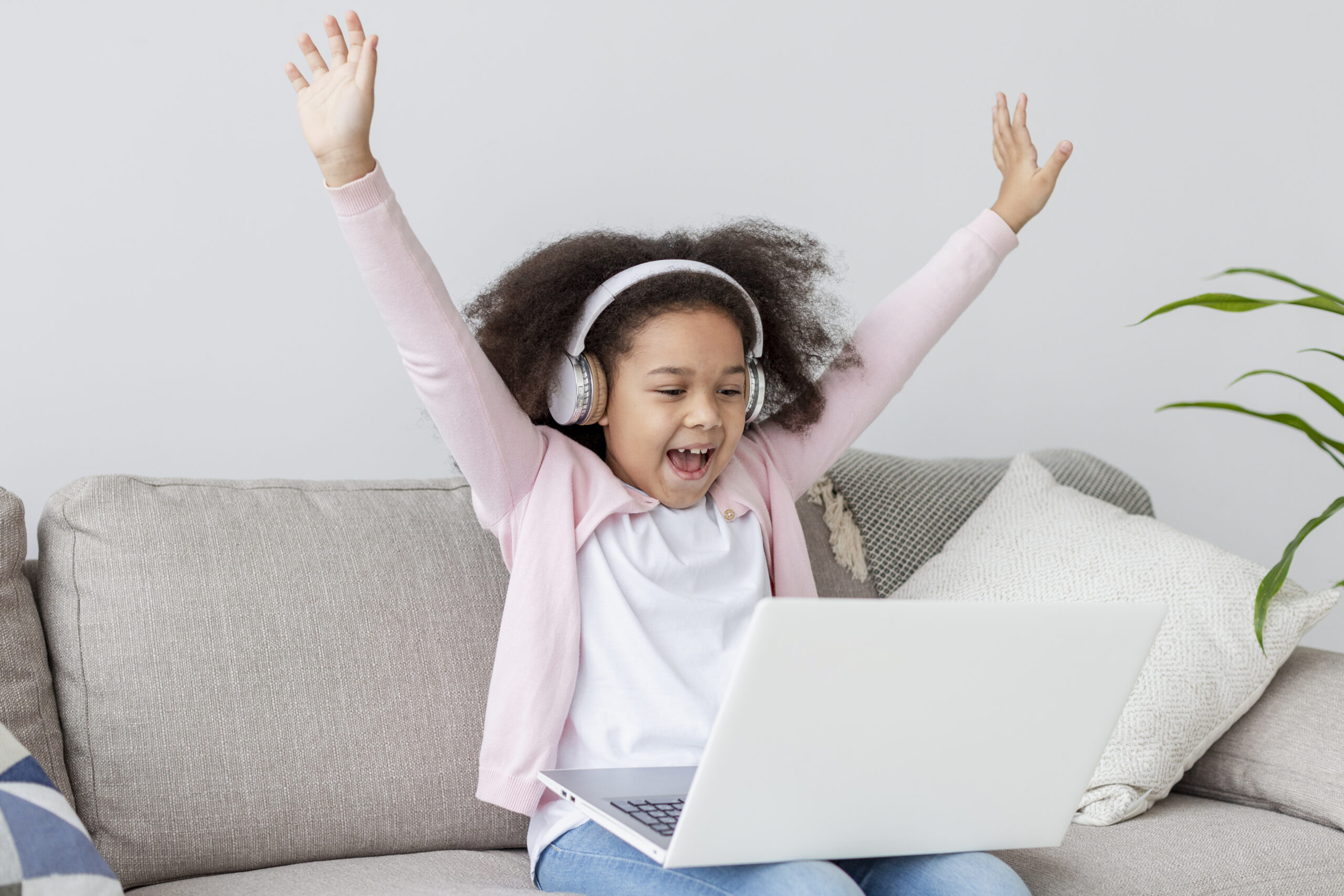 happy-young-girl-watching-cartoons-laptop